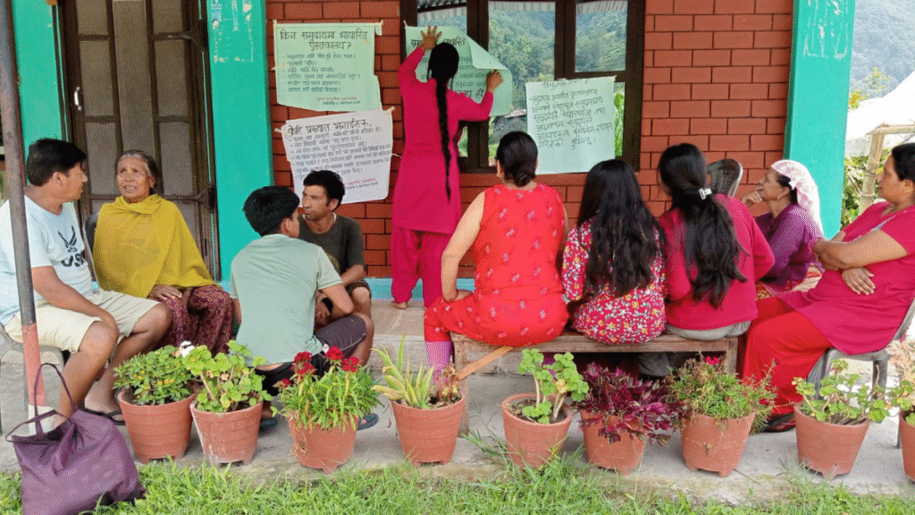 Librarian visits families in a Nepalese village