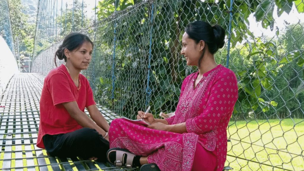 Villager listens intently as librarian introduces books